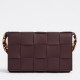 Bottega Veneta Cassette Bag In Burgundy Grained Intreccio Calfskin