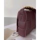 Bottega Veneta Cassette Bag In Burgundy Grained Intreccio Calfskin