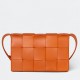 Bottega Veneta Cassette Bag In Orange Intreccio Lambskin