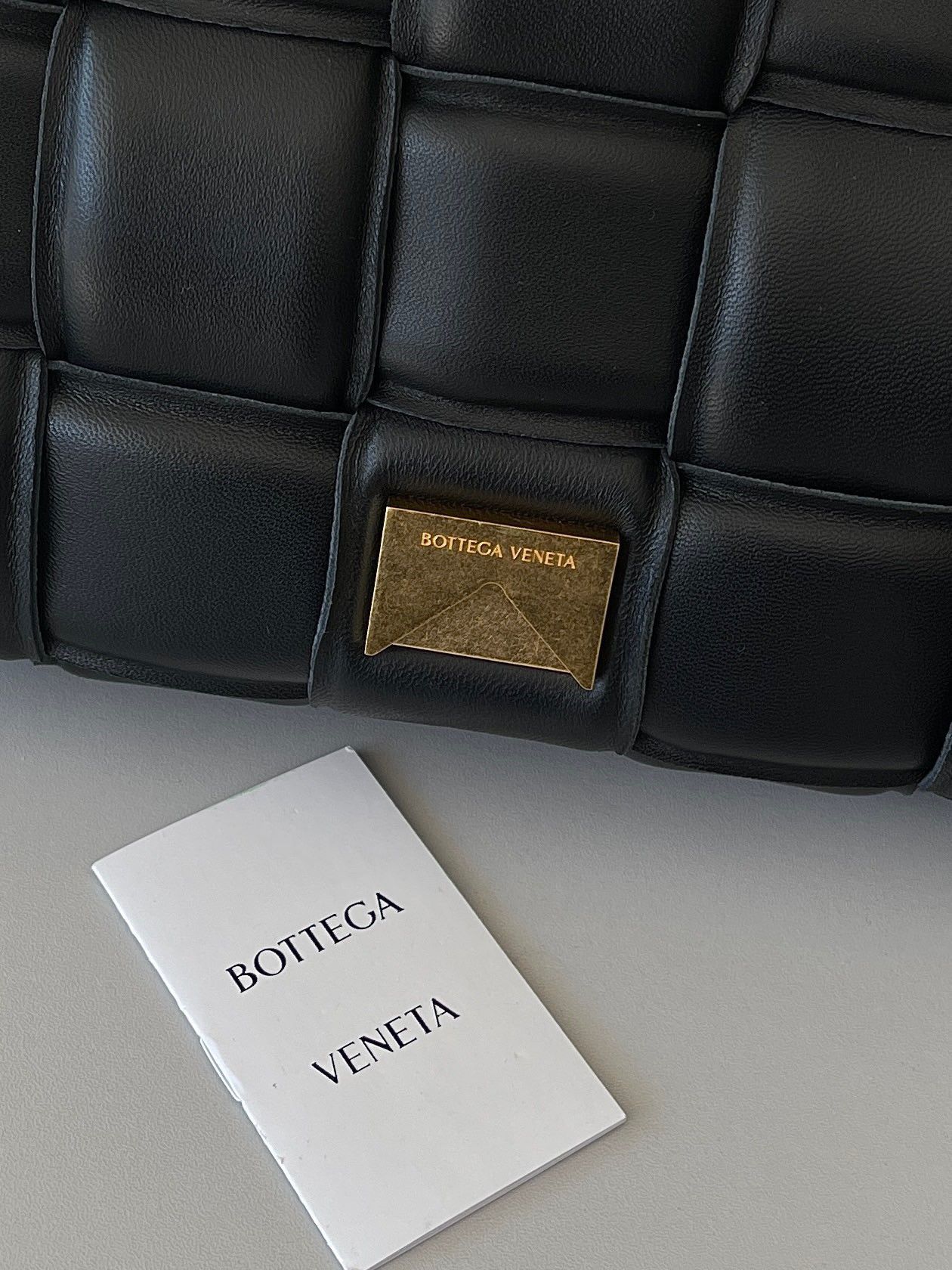 Bottega Veneta Padded Cassette Bag In Black Intrecciato Lambskin