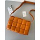 Bottega Veneta Padded Cassette Bag In Orange Intrecciato Lambskin