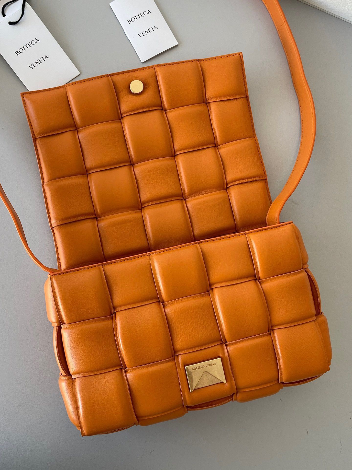 Bottega Veneta Padded Cassette Bag In Orange Intrecciato Lambskin