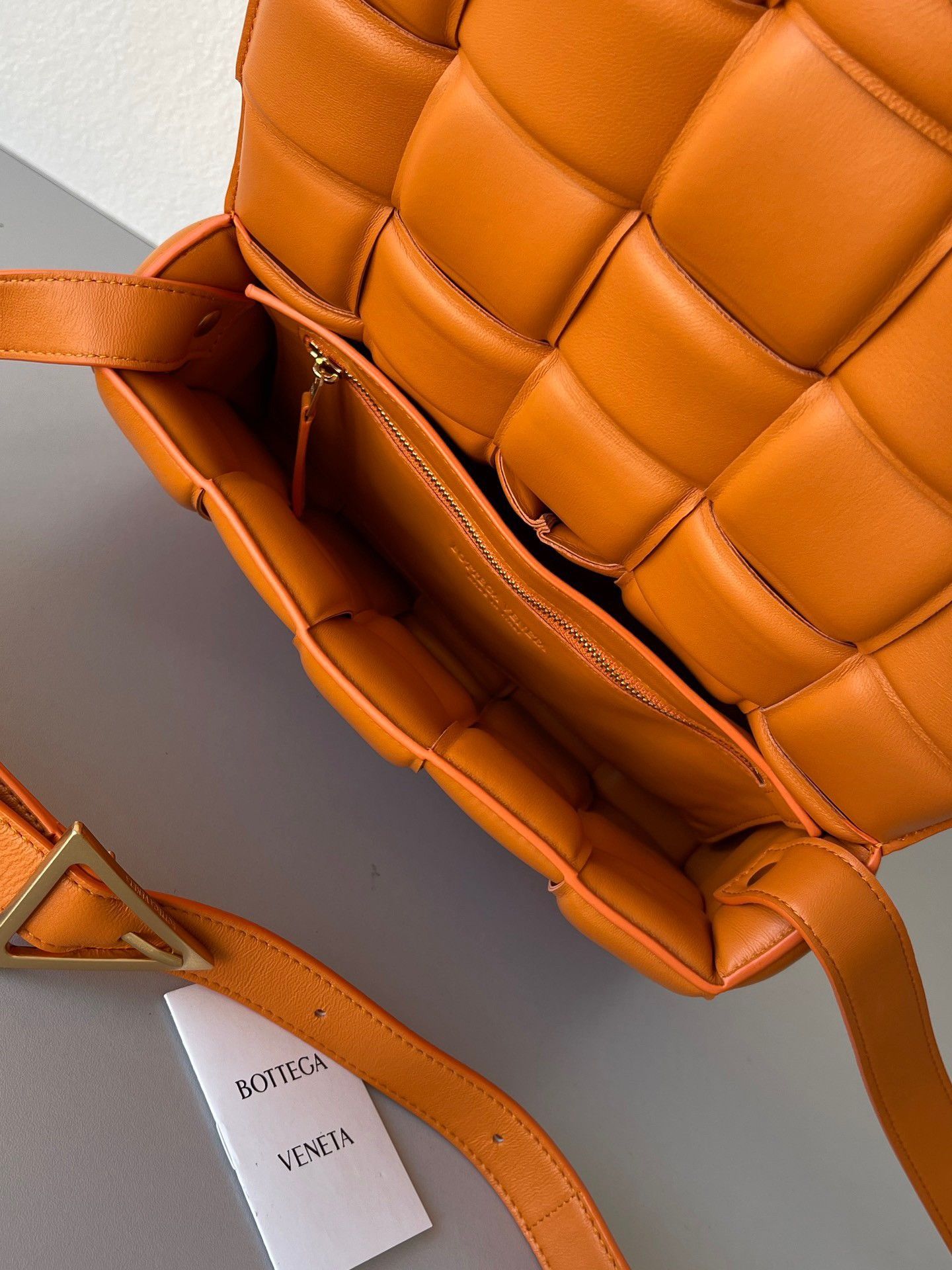 Bottega Veneta Padded Cassette Bag In Orange Intrecciato Lambskin