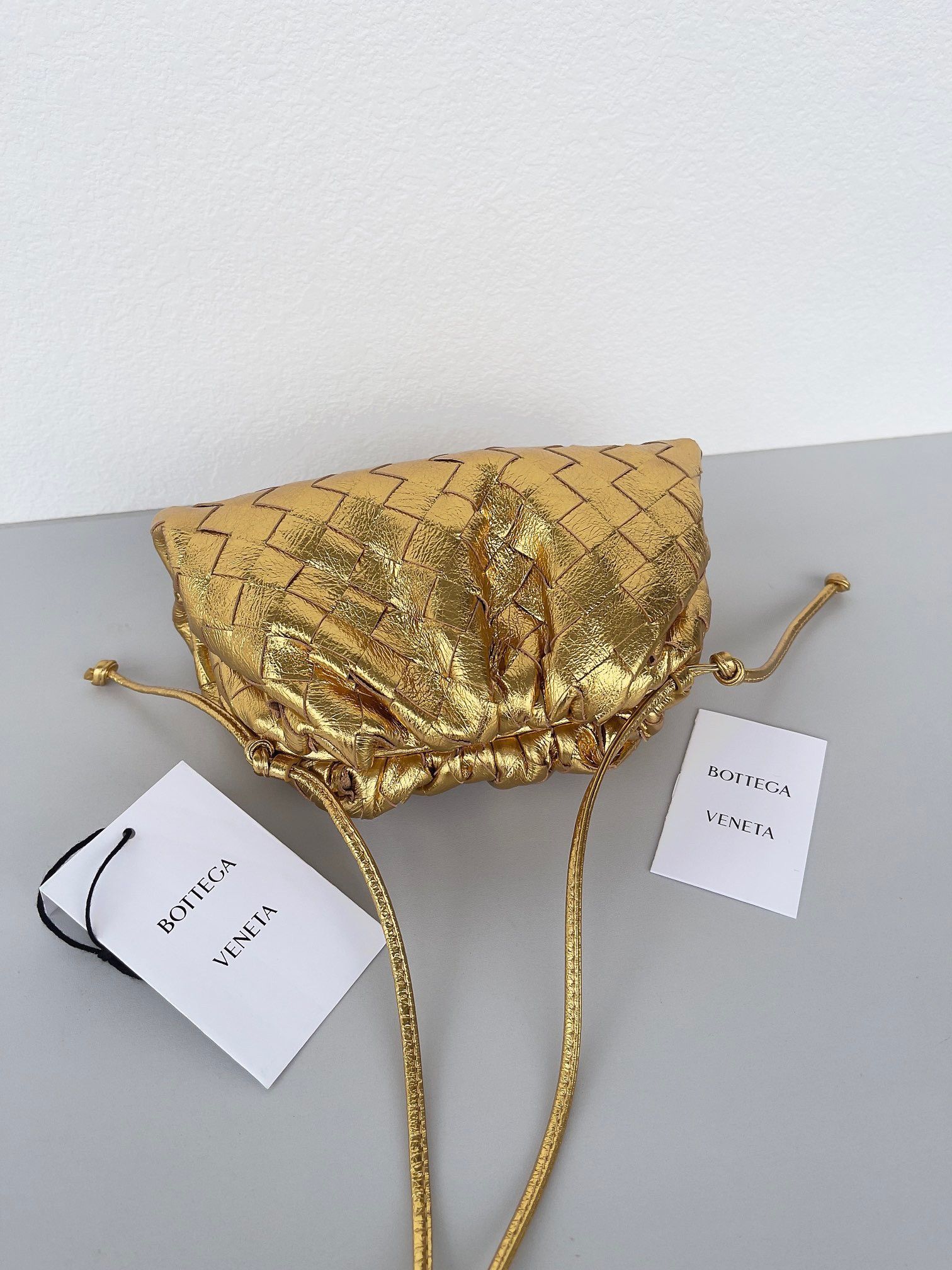 Bottega Veneta Mini Pouch with Strap in Gold Metallic Lambskin