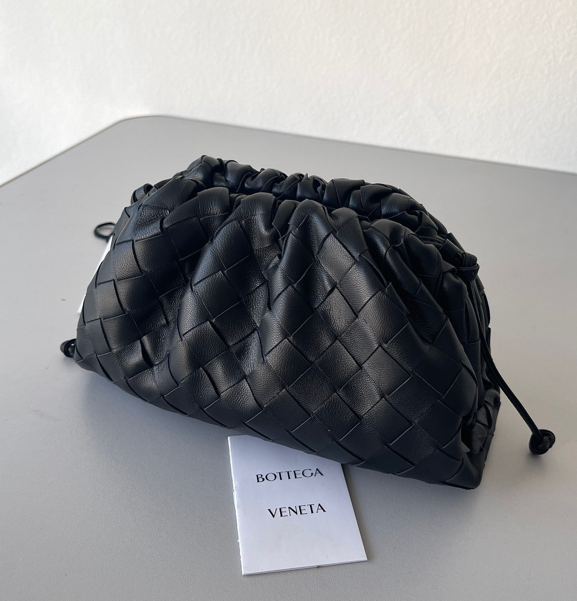 Bottega Veneta Mini Pouch with Strap in Black Intrecciato Lambskin