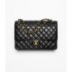 CHANEL Maxi Classic Handbag Black Grained Calfskin Gold Tone Metal