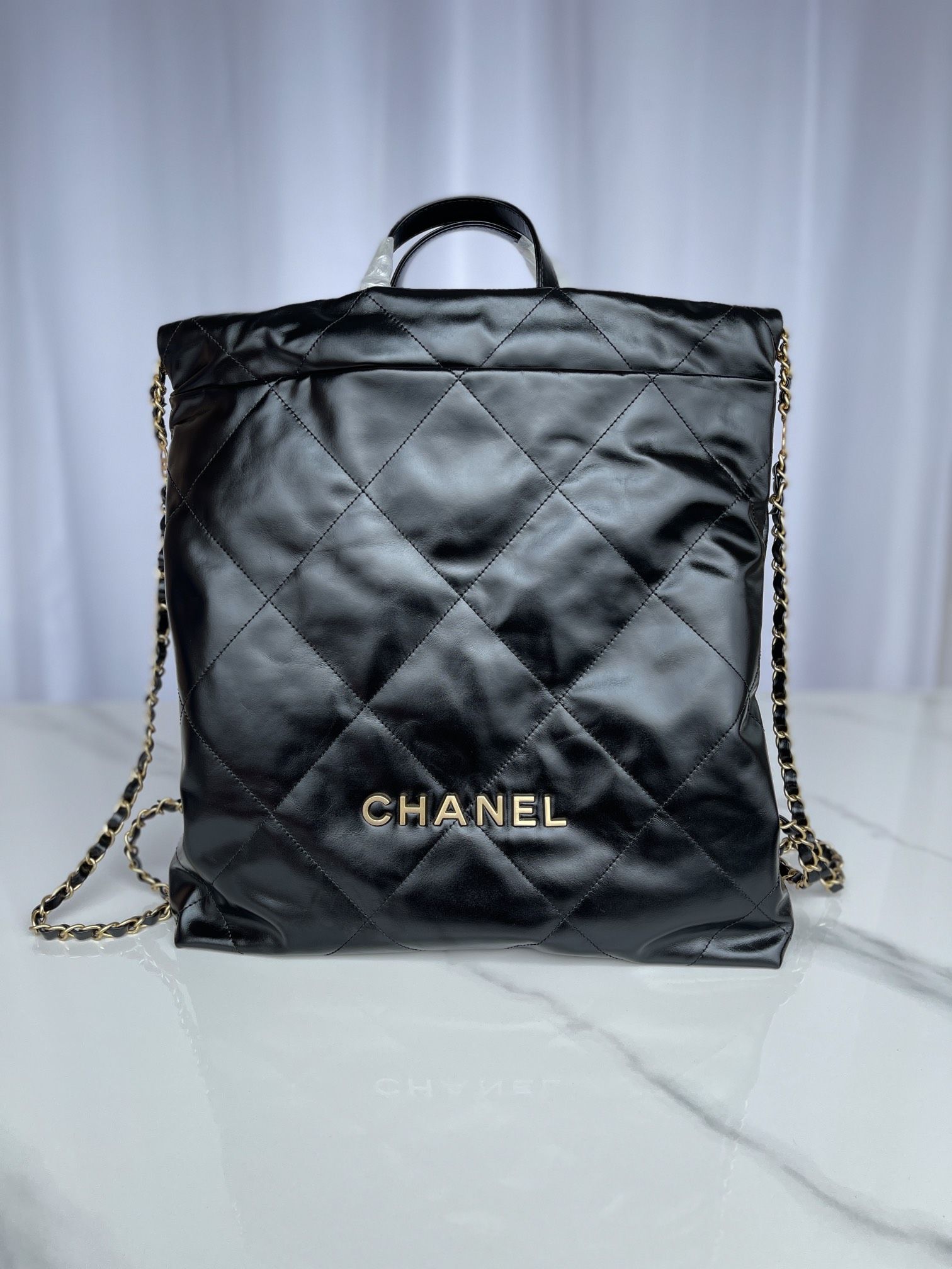 CHANEL Large Back Pack CHANEL 22 Black Shiny Calfskin Gold Tone Metal