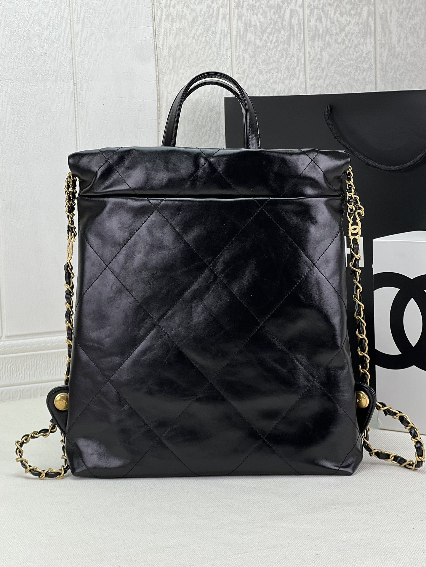 CHANEL 22 Backpack Black Shiny Calfskin Gold Tone Metal