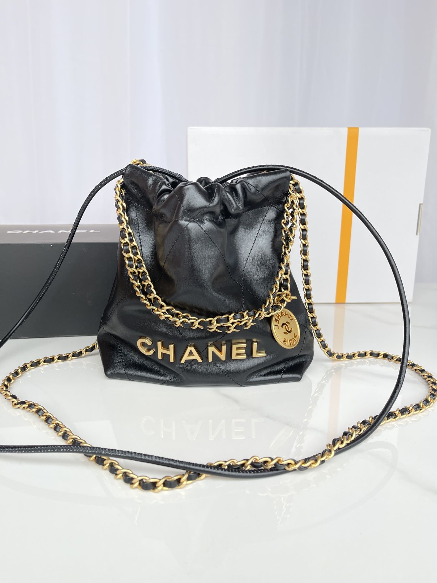 CHANEL 22 Mini Handbag Black Calfskin Gold Tone Lacquered Metal