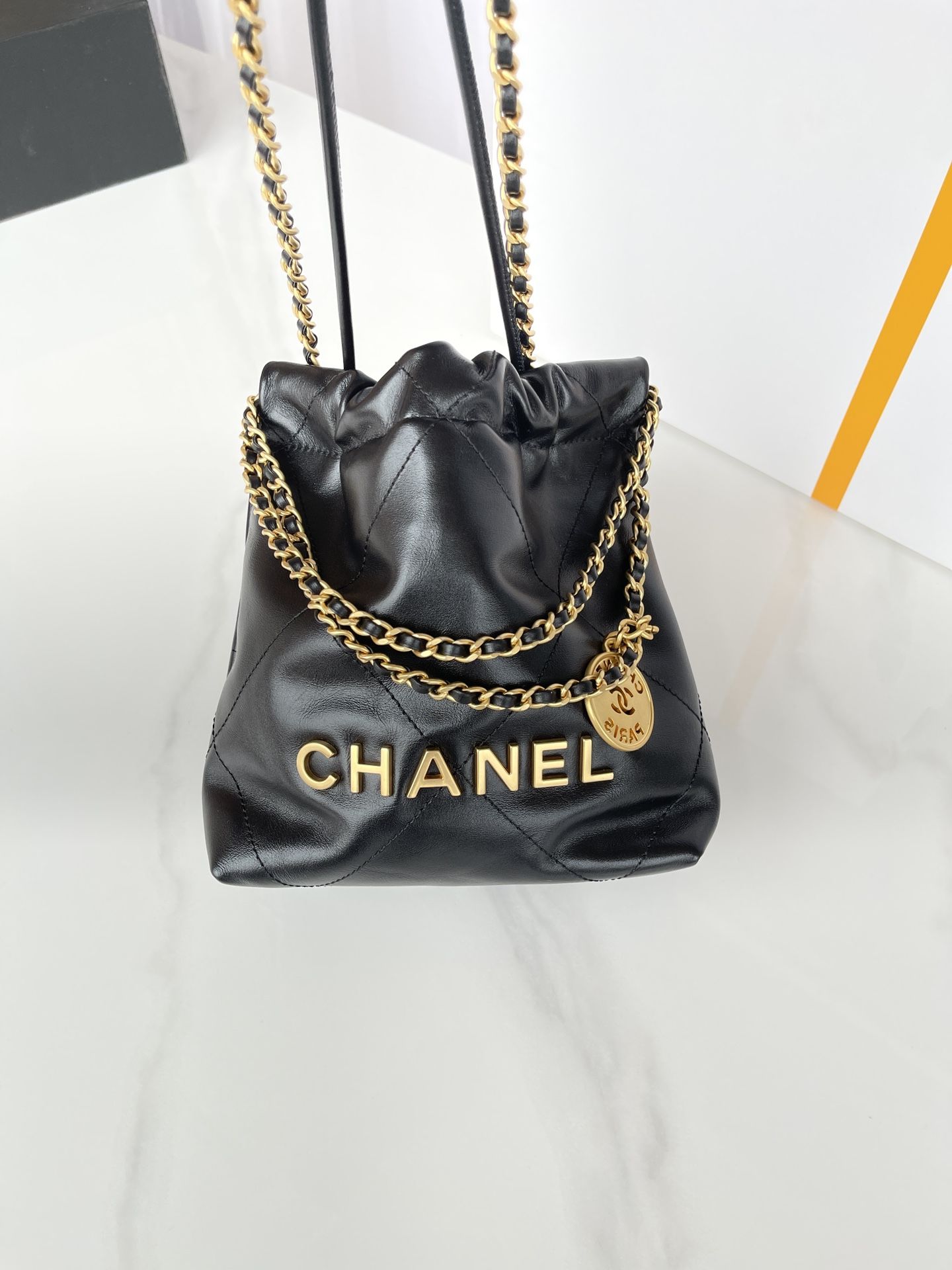 CHANEL 22 Mini Handbag Black Calfskin Gold Tone Lacquered Metal