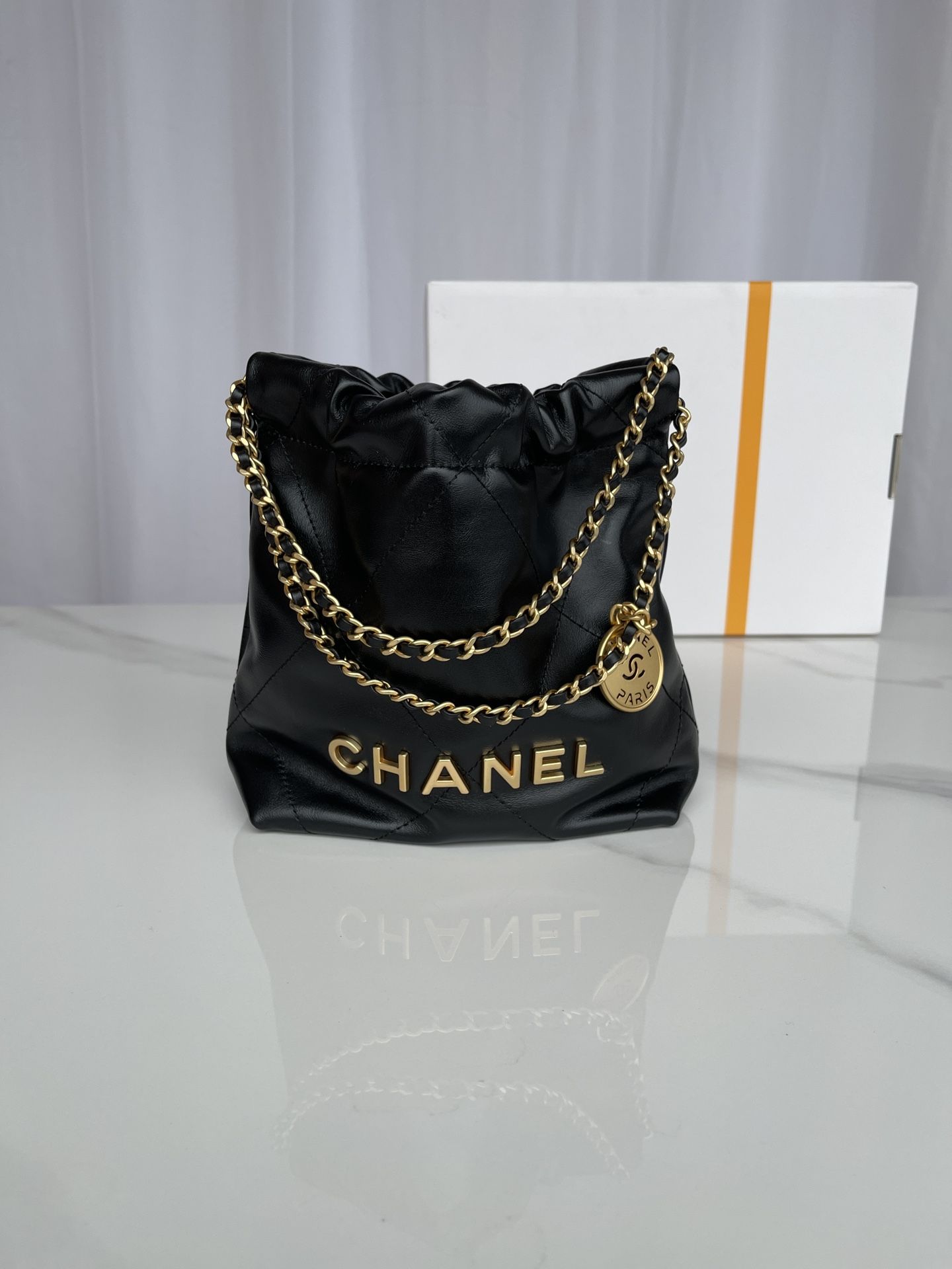 CHANEL 22 Mini Handbag Black Calfskin Gold Tone Lacquered Metal