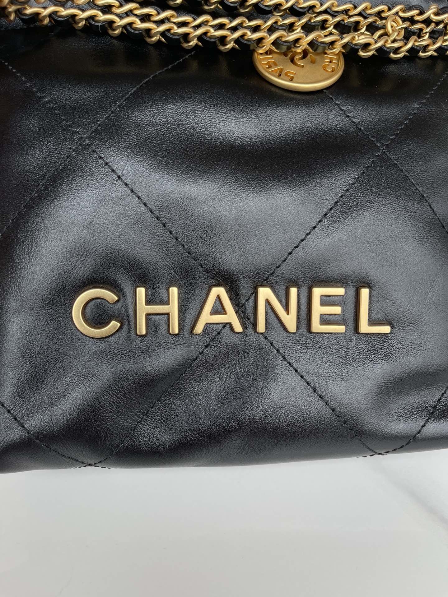 CHANEL 22 Mini Handbag Black Calfskin Gold Tone Lacquered Metal