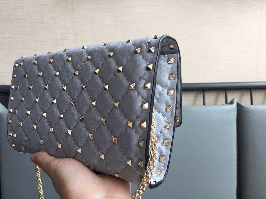 Valentino Rockstud Spike Crossbody Clutch Bag In Blue Lambskin